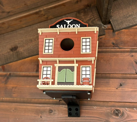 Western Saloon themed 3D printed birdhouse mounted outdoors on garden shed
