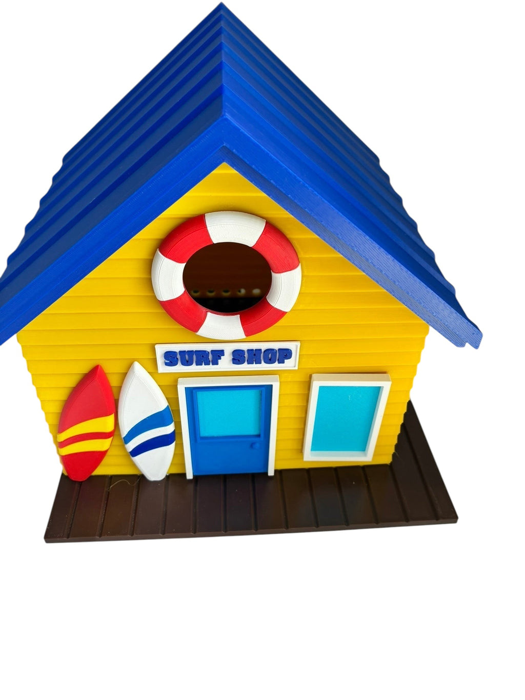 TL3D Prints blue and yellow surf shop birdhouse with surfboard and lifebuoy details, 35mm entrance hole.
