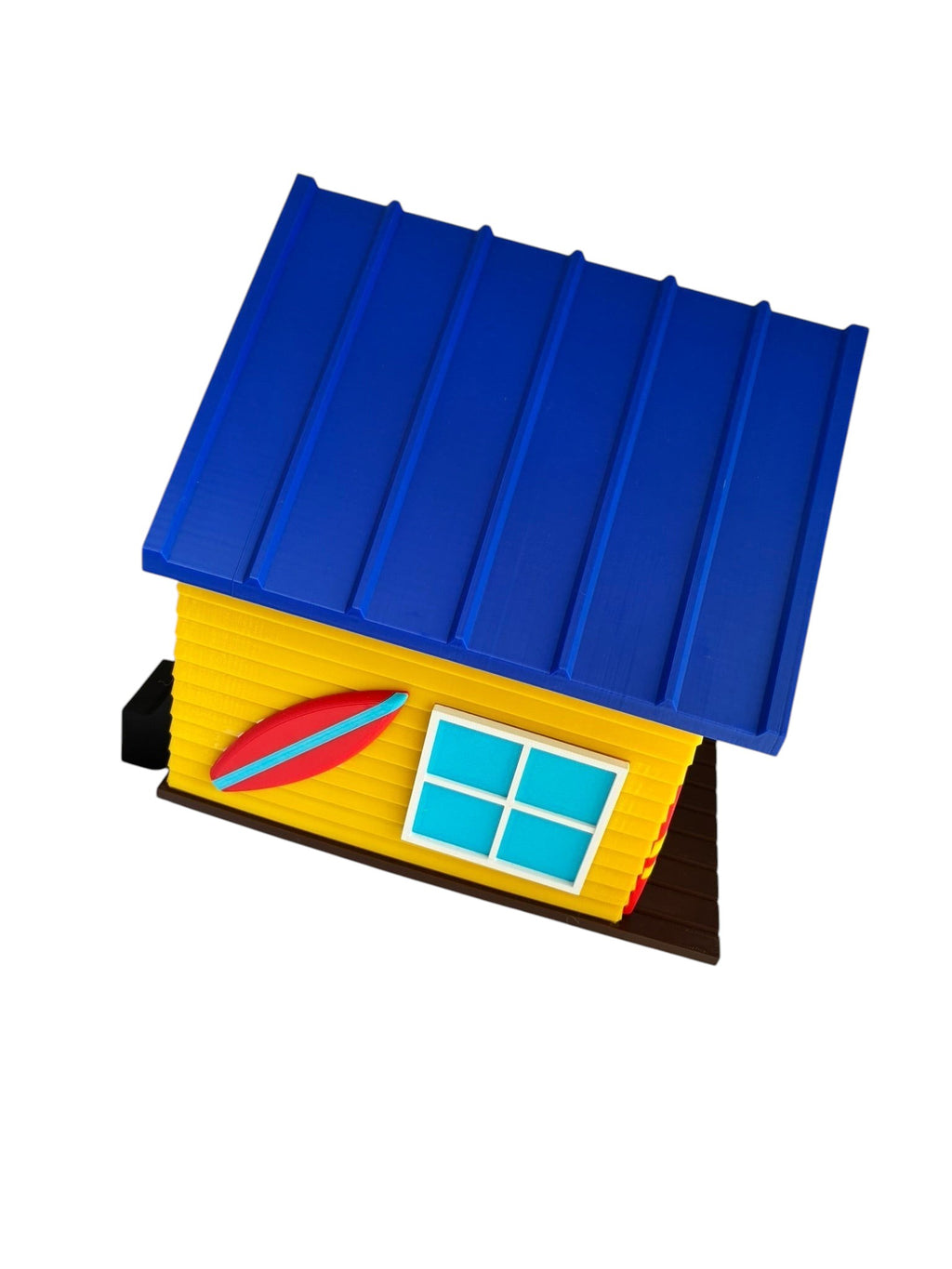 TL3D Prints surf shop birdhouse, yellow with blue roof, red surfboard detail, and blue window. 3D printed PETG.