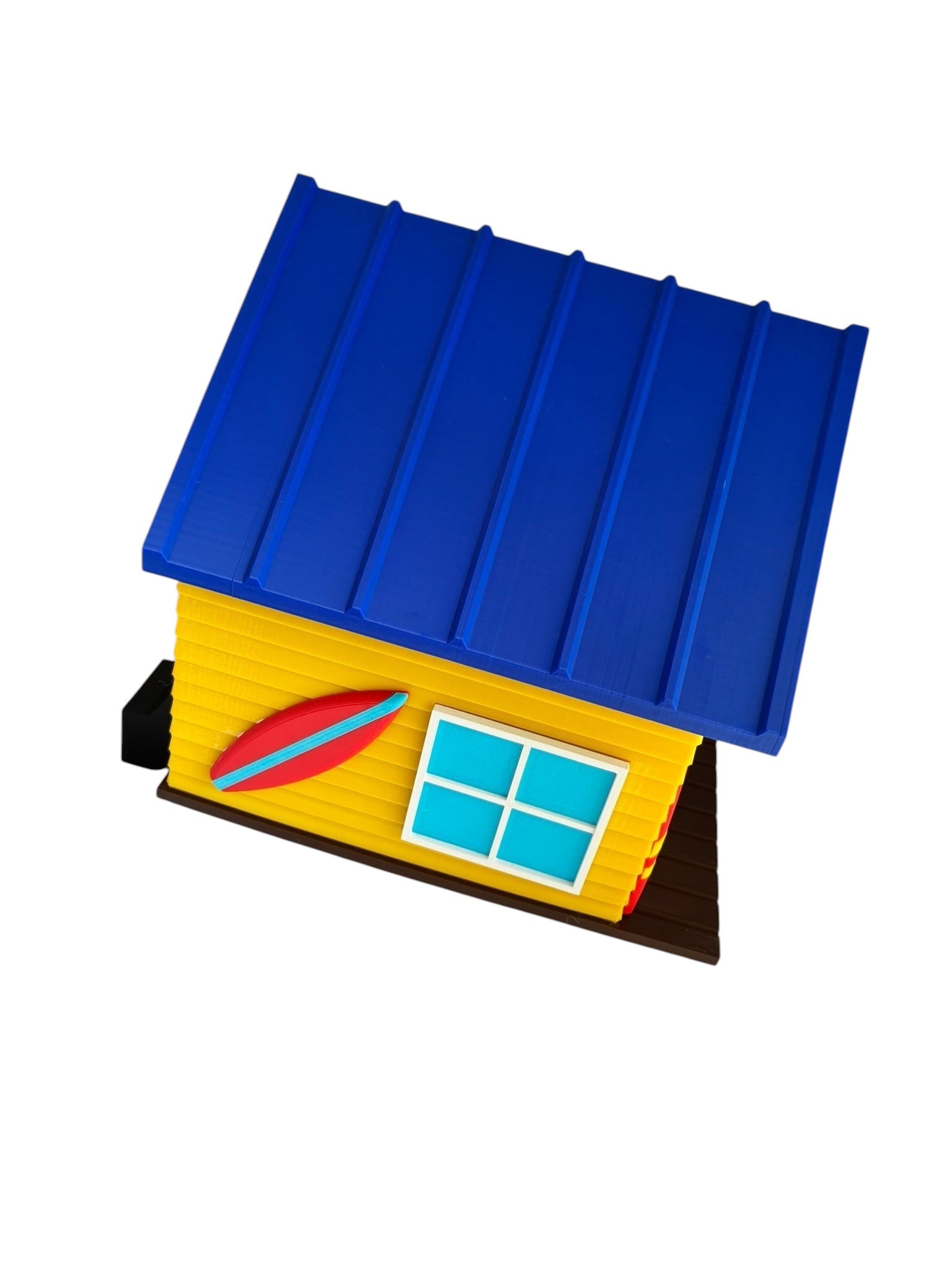 TL3D Prints surf shop birdhouse, yellow with blue roof, red surfboard detail, and blue window. 3D printed PETG.