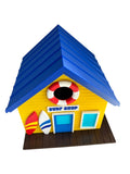 TL3D Prints yellow surf shop birdhouse with blue roof, surfboards, lifebuoy entrance, and tropical signage.